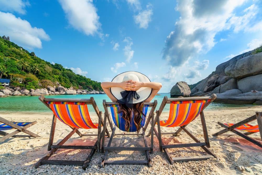 Cele mai bune destinații exotice pentru un buget redus 1 woman with hat sitting chairs beach beautiful tropical beach woman relaxing tropical beach koh nangyuan island
