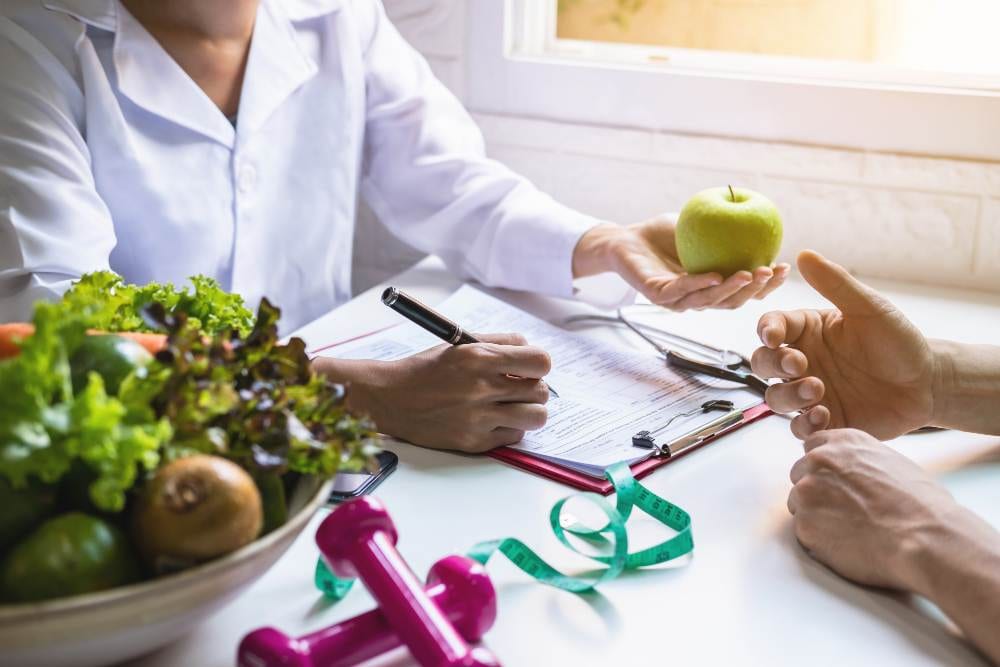 nutritionist giving consultation patient with healthy fruit vegetable right nutrition diet